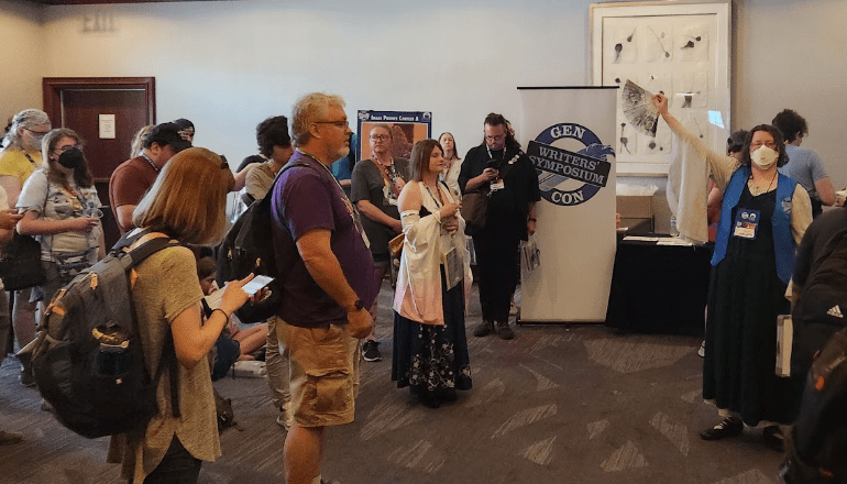 More Symposium attendees in the hallway waiting for the next panel
